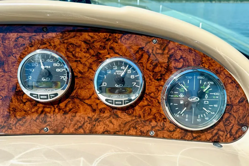 Slide: The Image of Dashboard of 2005 Sea Ray 340 Sundancer with speedometer, tachometer, and pressure gauges. - 32