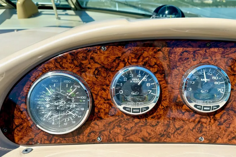Slide: The Image of Dashboard of 2005 Sea Ray 340 Sundancer with three gauges on wood panel. - 33