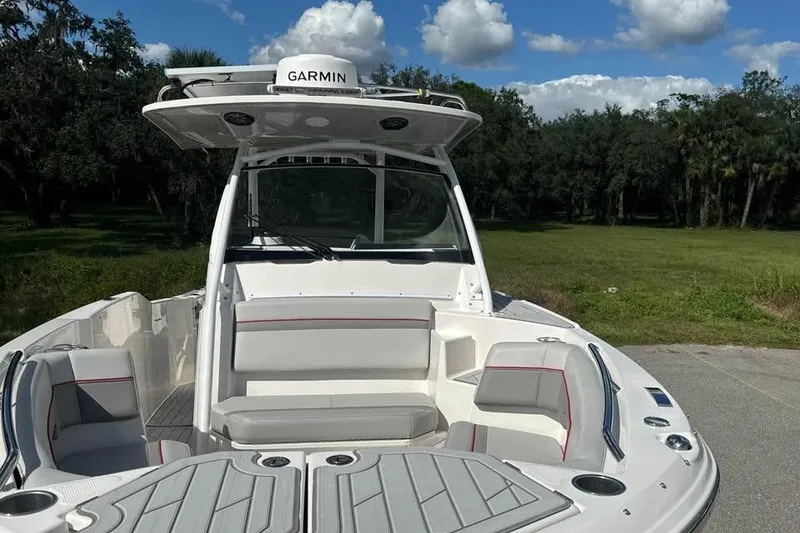 Slide: The Image of 2023 Solara S-250 CW boat with Garmin equipment, featuring spacious seating and sleek design. - 11