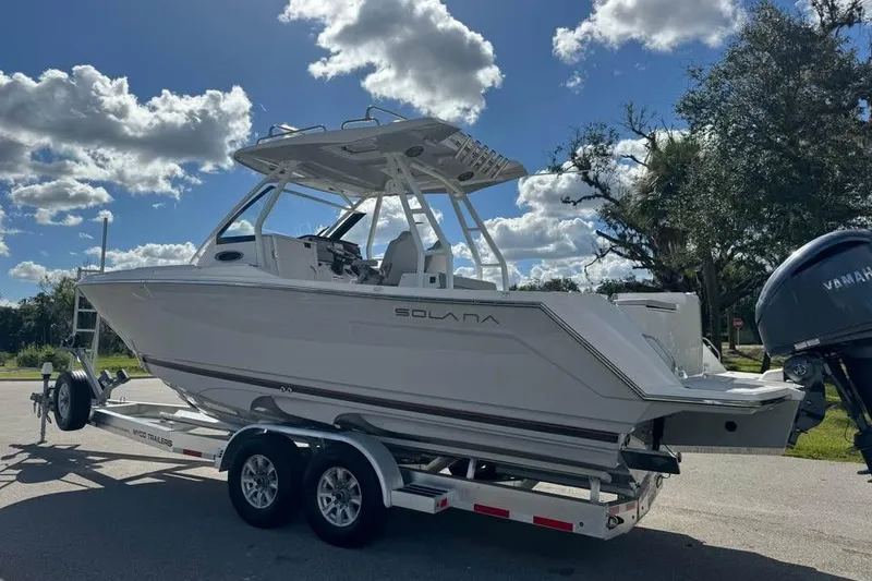Slide: The Image of 2023 Solara S-250 CW boat on trailer under a sunny sky. - 4