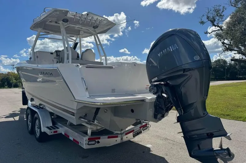 Slide: The Image of 2023 Solara S-250 CW boat on trailer with Yamaha outboard motor, under sunny sky. - 8