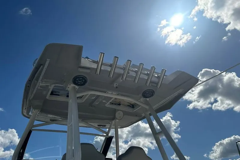 Slide: The Image of 2023 Solara S-250 CW boat canopy against a bright blue sky with clouds. - 9