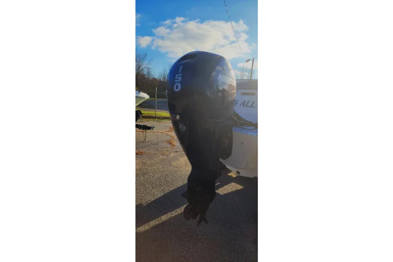 Slide: The Image of 2022 Bayliner VR6 Bowrider OB with Mercury 150 outboard motor in sunny setting. - 16