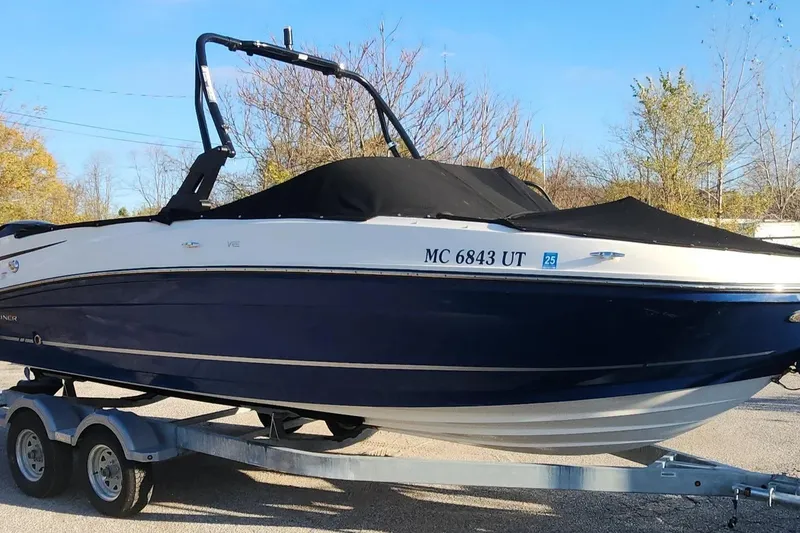 Slide: The Image of 2022 Bayliner VR6 Bowrider OB on trailer, covered, parked outdoors. - 18
