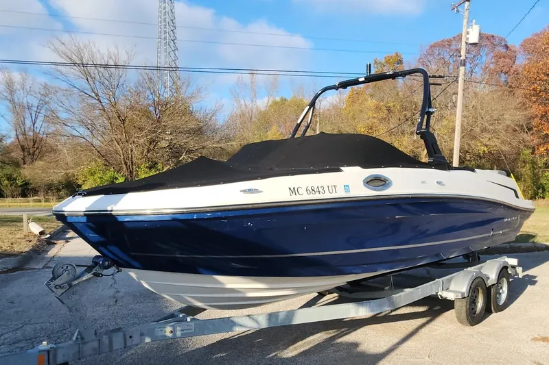 Slide: The Image of 2022 Bayliner VR6 Bowrider OB on trailer, covered, parked outdoors. - 19
