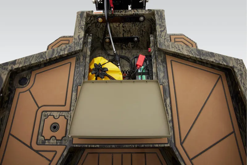 Slide: The Image of Manufacturer Provided Image: 2026 Tracker Grizzly 1650 T Prairie Wings Edition boat storage compartment with gear and accessories. - 20