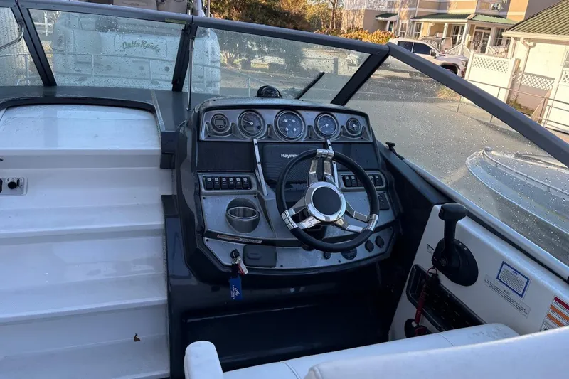 Slide: The Image of 2016 Monterey 275 Sport Yacht dashboard with steering wheel and control panel. - 4