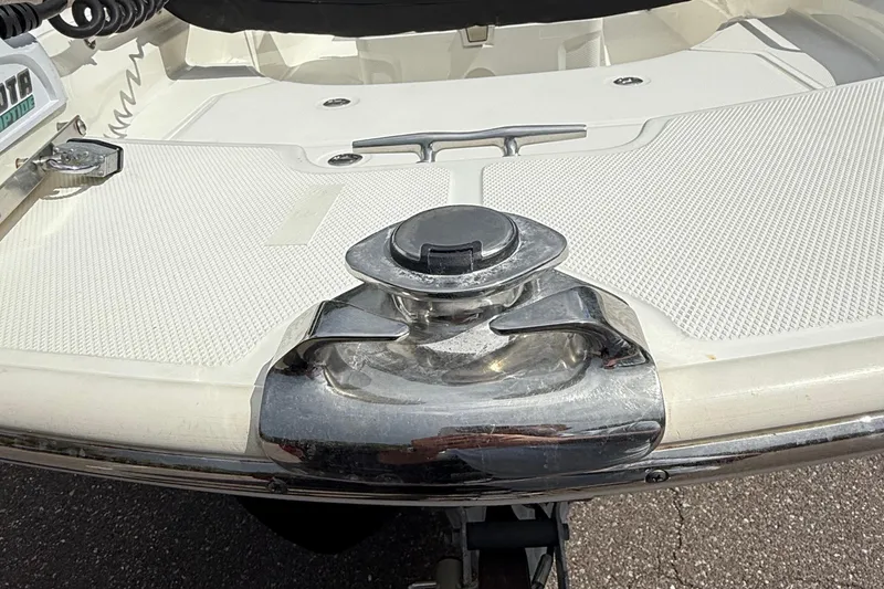 Slide: The Image of 2021 Boston Whaler 170 Montauk boat deck with chrome hardware and textured surface. - 12