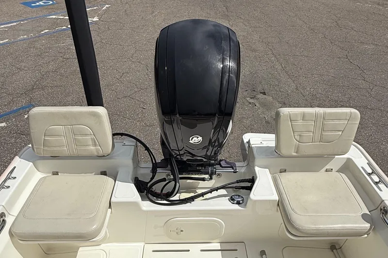 Slide: The Image of 2021 Boston Whaler 170 Montauk boat interior with motor and seating. - 20
