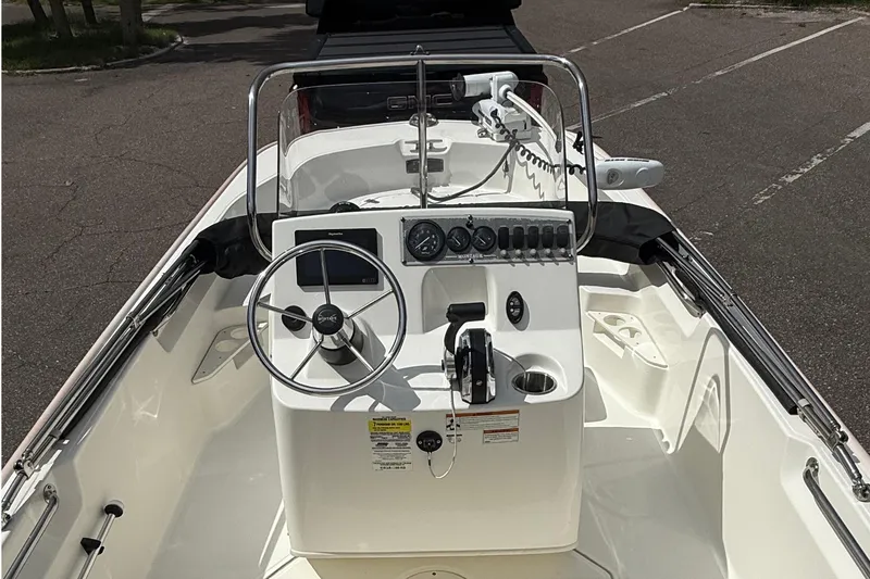 Slide: The Image of 2021 Boston Whaler 170 Montauk boat interior with steering console and controls. - 21