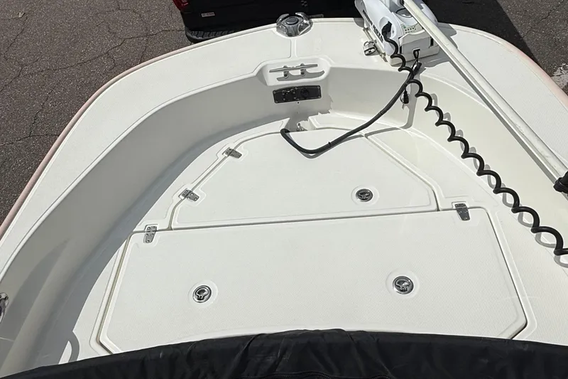 Slide: The Image of 2021 Boston Whaler 170 Montauk boat deck with storage compartments and trolling motor. - 32