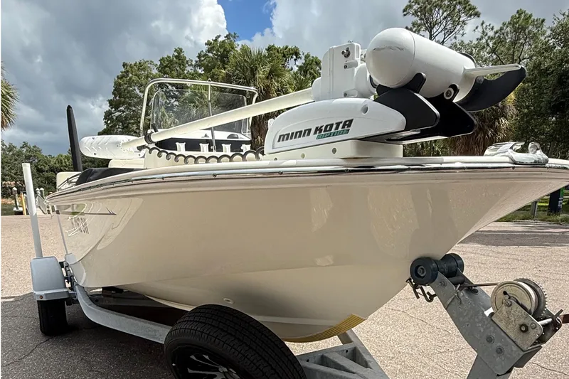 Slide: The Image of 2021 Boston Whaler 170 Montauk boat on trailer with Minn Kota trolling motor. - 9