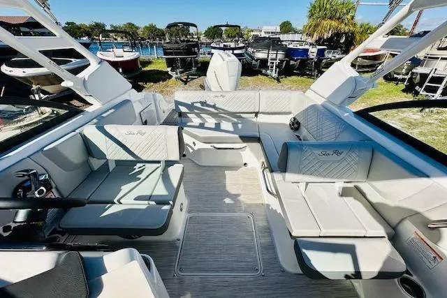 Slide: The Image of 2026 Sea Ray SPX 230 Outboard boat interior with spacious seating and modern design. - 14