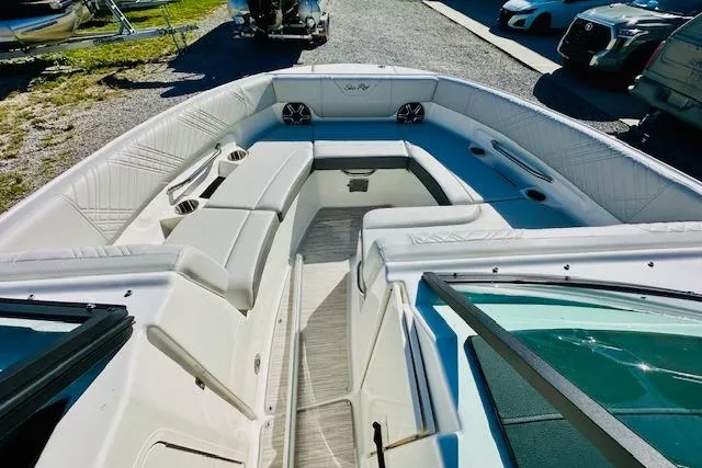 Slide: The Image of 2026 Sea Ray SPX 230 Outboard boat interior with spacious seating and modern design. - 15