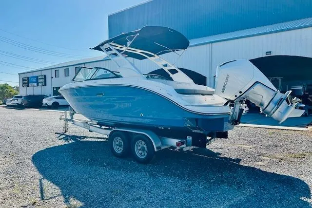 Slide: The Image of 2026 Sea Ray SPX 230 Outboard boat on trailer, parked outdoors. - 6
