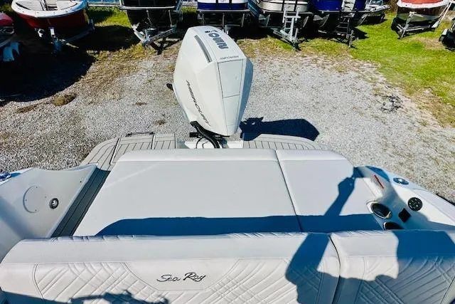 Slide: The Image of 2026 Sea Ray SPX 230 Outboard boat with Yamaha engine, docked on gravel. - 8