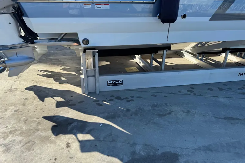 Slide: The Image of 2023 Formula 400 Super Sport Crossover on Myco trailer, docked on concrete surface. - 24