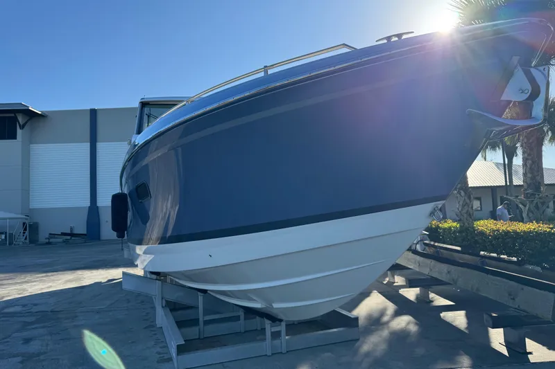 Slide: The Image of 2023 Formula 400 Super Sport Crossover boat on display in a sunny outdoor setting. - 28