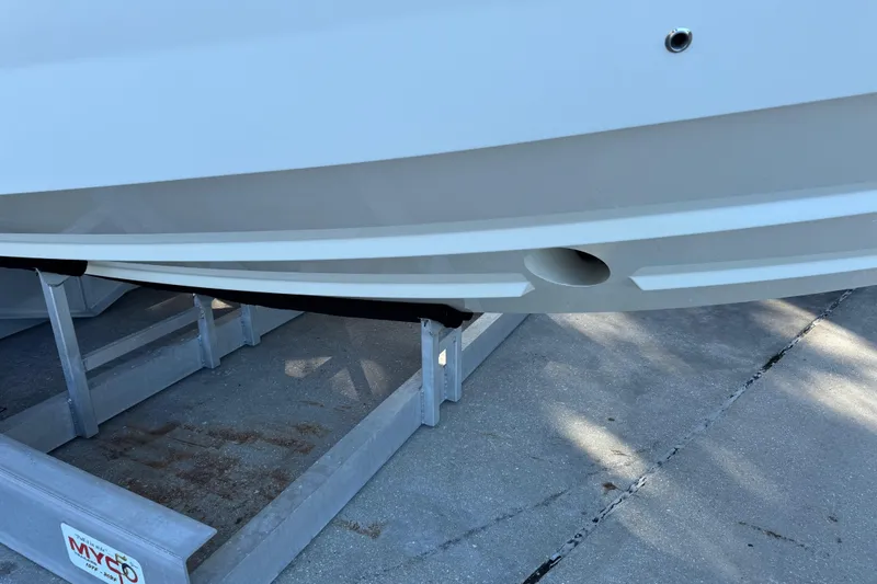 Slide: The Image of 2023 Formula 400 Super Sport Crossover boat hull on trailer, close-up view. - 30