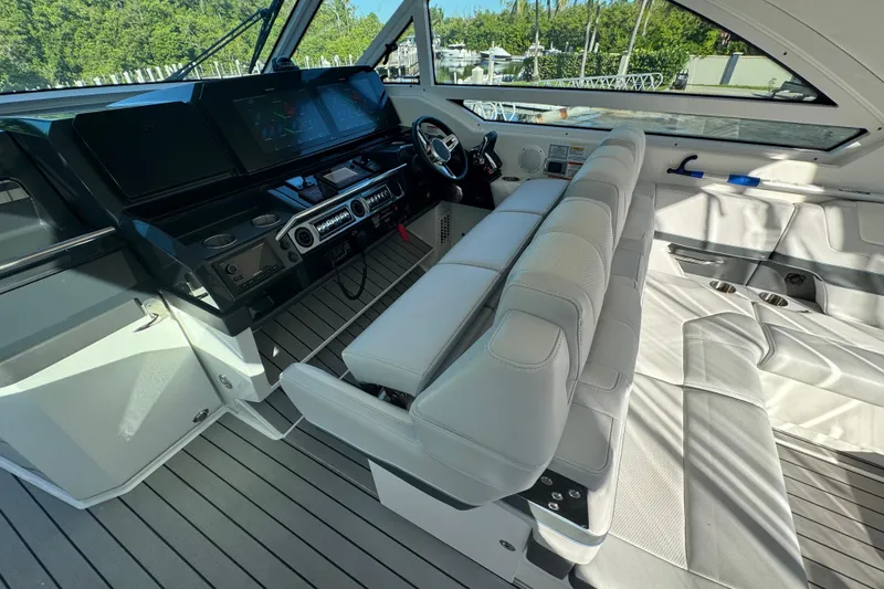 Slide: The Image of 2023 Formula 400 Super Sport Crossover cockpit with modern controls and seating. - 54