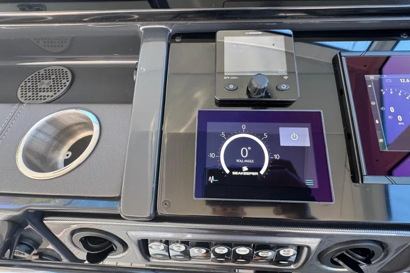 Slide: The Image of Dashboard of 2023 Formula 400 Super Sport Crossover with Seakeeper display and controls. - 57