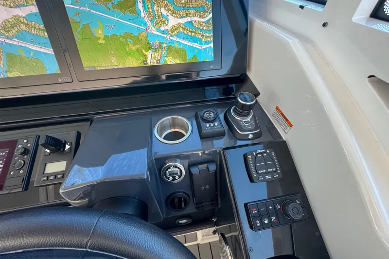 Slide: The Image of Control panel of 2023 Formula 400 Super Sport Crossover with navigation screens and joystick controls. - 60