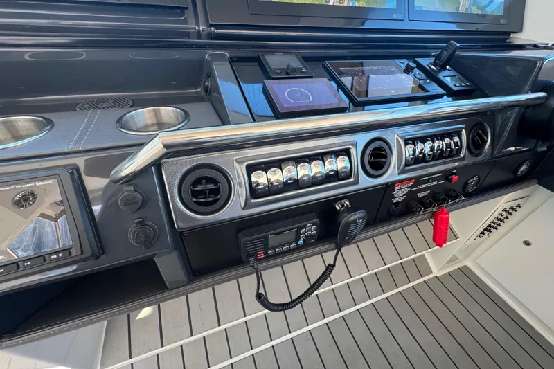 Slide: The Image of 2023 Formula 400 Super Sport Crossover dashboard with advanced controls and navigation systems. - 63