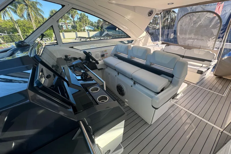Slide: The Image of 2023 Formula 400 Super Sport Crossover yacht interior with luxurious seating and modern helm. - 65