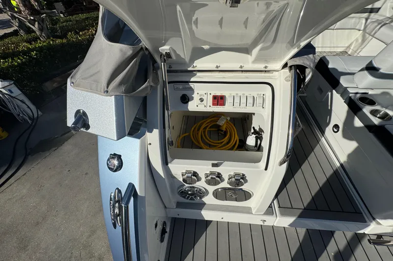 Slide: The Image of 2023 Formula 400 Super Sport Crossover boat electrical panel with storage compartment. - 67
