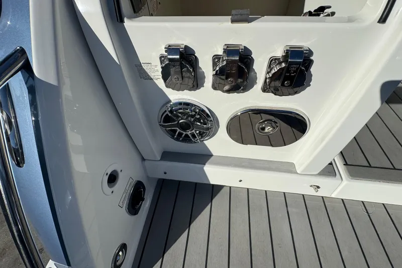 Slide: The Image of 2023 Formula 400 Super Sport Crossover boat controls and speaker on deck. - 68