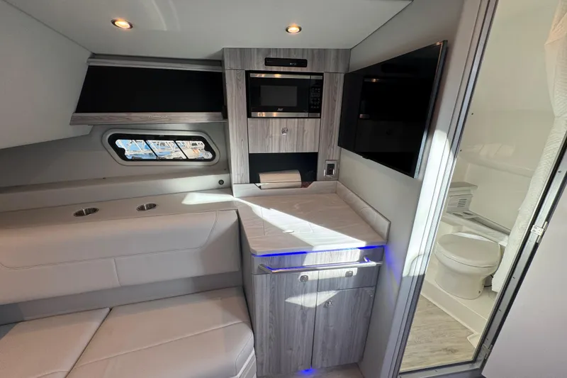 Slide: The Image of 2023 Formula 400 Super Sport Crossover interior with modern kitchenette and bathroom. - 73