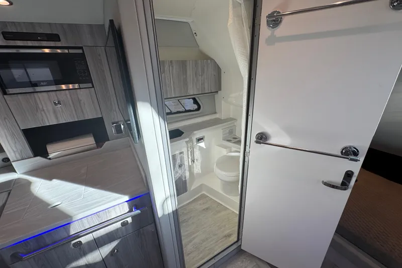 Slide: The Image of 2023 Formula 400 Super Sport Crossover interior with modern kitchen and bathroom. - 75