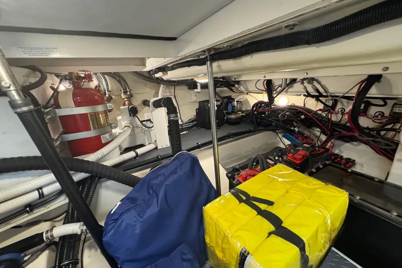 Slide: The Image of Engine room of 2023 Formula 400 Super Sport Crossover with fire extinguisher and wiring. - 80