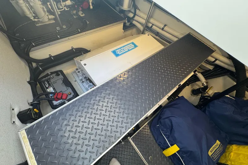 Slide: The Image of Engine compartment of 2023 Formula 400 Super Sport Crossover with battery and wiring. - 82