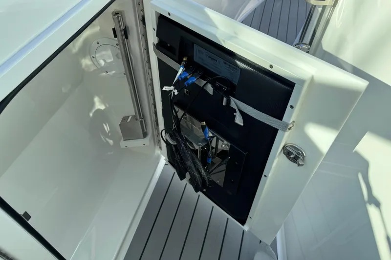 Slide: The Image of 2023 Formula 400 Super Sport Crossover boat interior compartment with open access panel. - 84