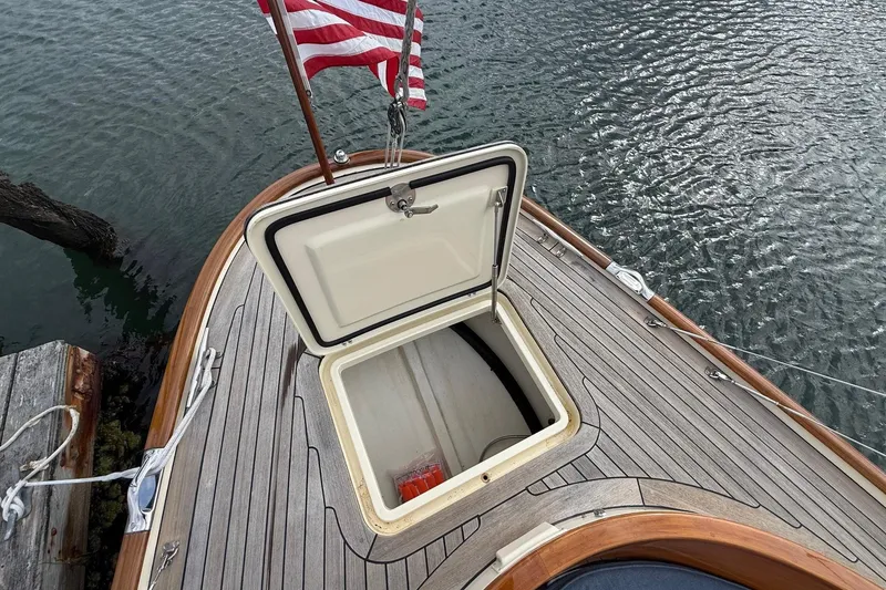 Slide: The Image of Open hatch on 2015 Hinckley DS 42 boat deck with American flag. - 25