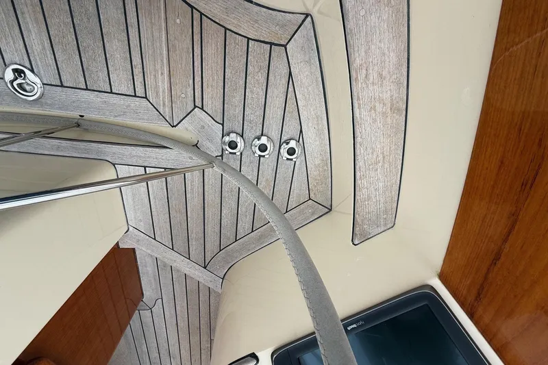 Slide: The Image of Interior view of 2015 Hinckley DS 42 yacht with wood paneling and metal fixtures. - 27