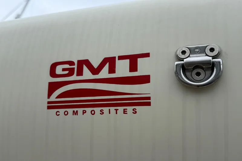 Slide: The Image of GMT Composites logo on 2015 Hinckley DS 42 boat, featuring a metal latch. - 28