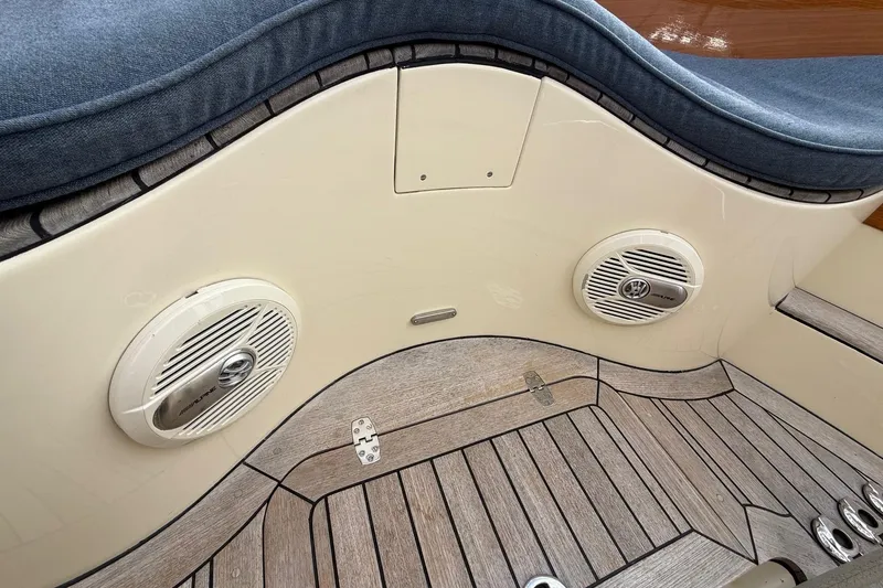 Slide: The Image of Hinckley DS 42 (2015) boat interior with speakers and wooden flooring. - 34