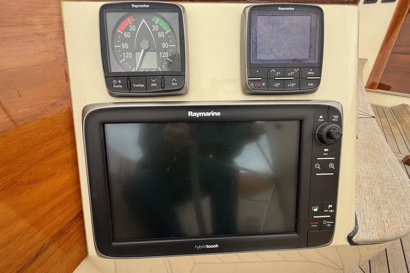 Slide: The Image of Hinckley DS 42 2015 yacht navigation panel with Raymarine instruments. - 42