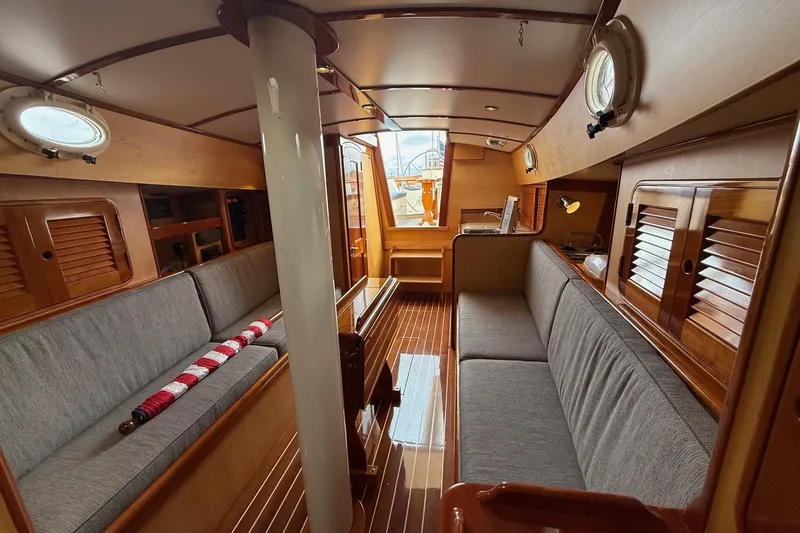 Slide: The Image of Interior of 2015 Hinckley DS 42 yacht with wooden finish and cozy seating. - 55
