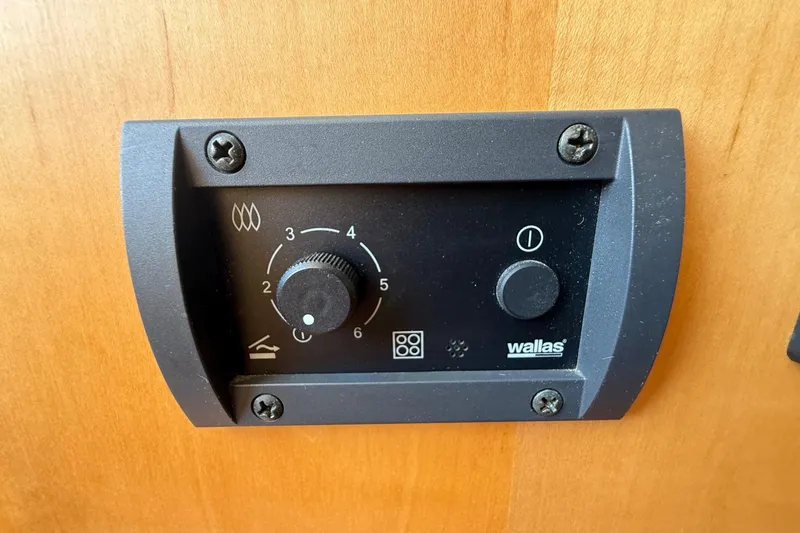 Slide: The Image of Control panel on a 2015 Hinckley DS 42 boat, featuring Wallas heater settings. - 71