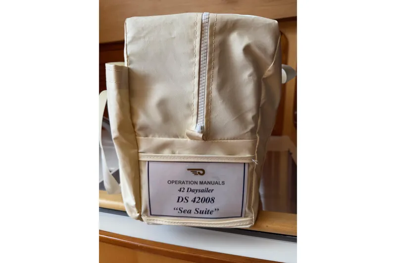 Slide: The Image of Operation manuals bag for 2015 Hinckley DS 42 Daysailer, labeled "Sea Suite." - 75
