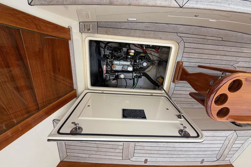 Slide: The Image of Engine compartment of a 2015 Hinckley DS 42 boat, showcasing interior details. - 76
