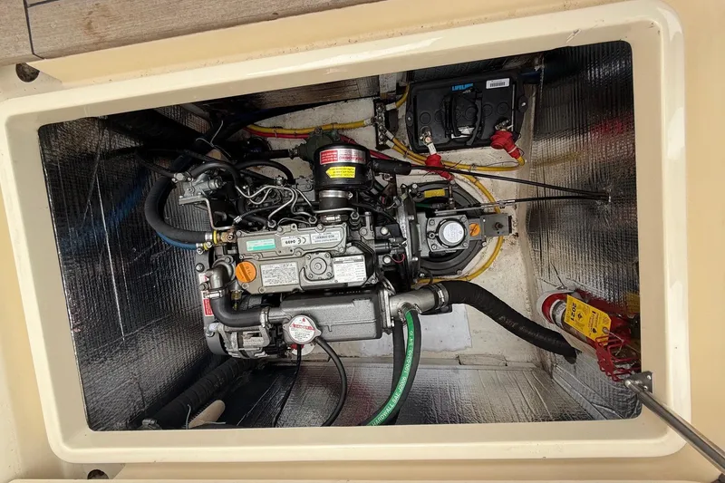 Slide: The Image of Engine compartment of a 2015 Hinckley DS 42 boat, showcasing detailed mechanical components. - 80