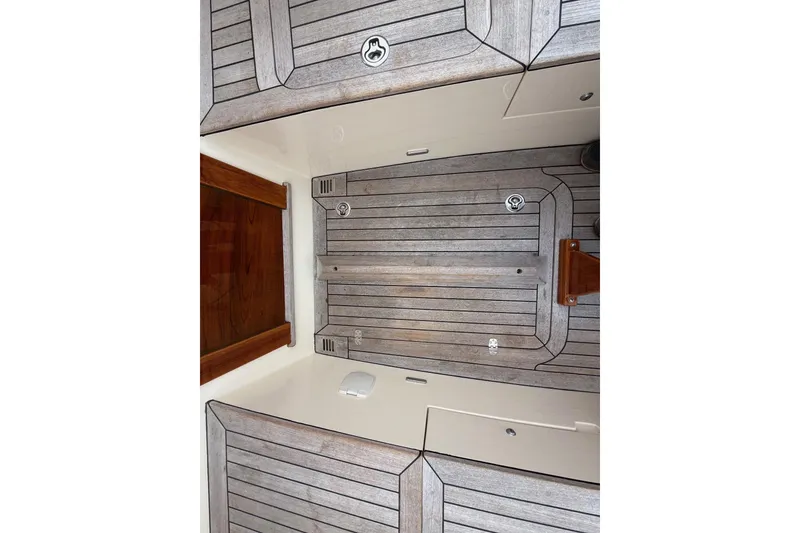 Slide: The Image of Hinckley DS 42 (2015) boat deck with wooden finish and sleek design. - 24