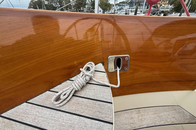Slide: The Image of Polished wood finish on 2015 Hinckley DS 42 sailboat with coiled rope detail. - 26
