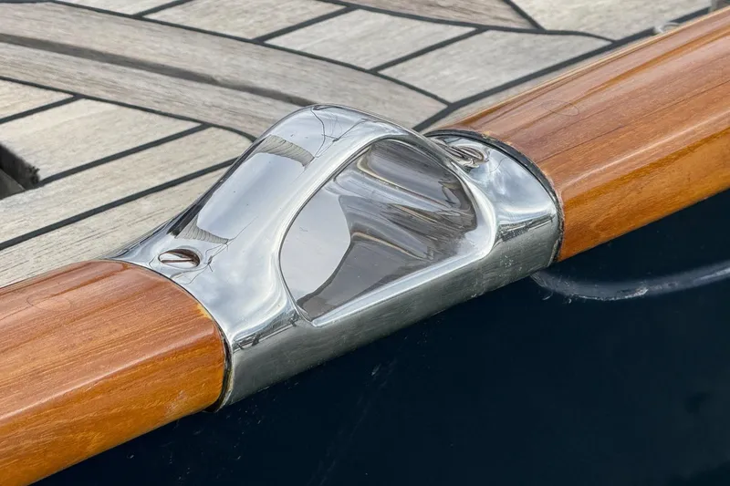 Slide: The Image of Close-up of 2015 Hinckley DS 42 boat's polished metal and wood detail. - 32
