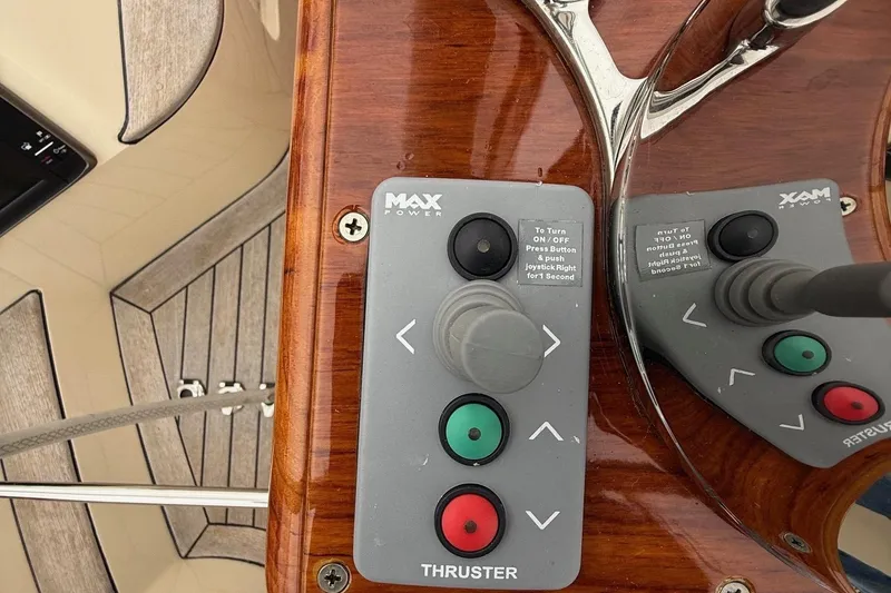 Slide: The Image of Hinckley DS 42 2015 boat thruster control panel with joystick and buttons. - 40