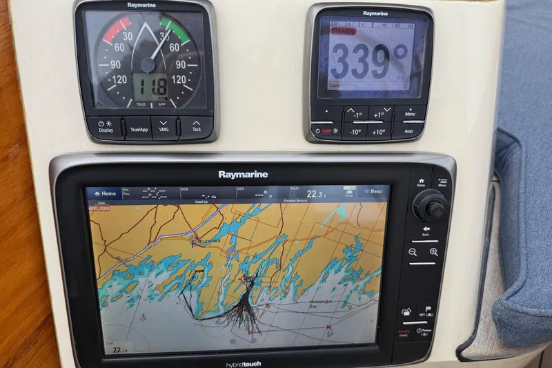 Slide: The Image of Hinckley DS 42 yacht navigation system with Raymarine displays showing map and compass. - 41